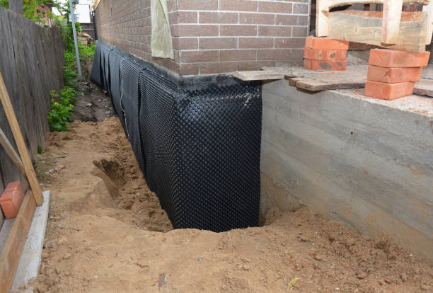 Happy homeowners after waterproofing job in Decatur